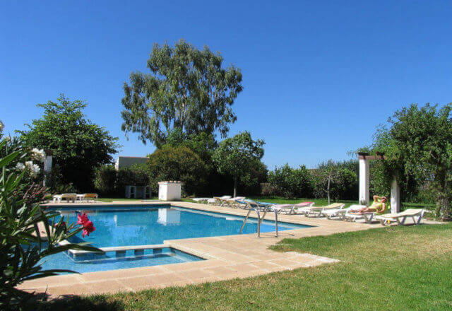 Photo of pool and lawn of the holiday villa